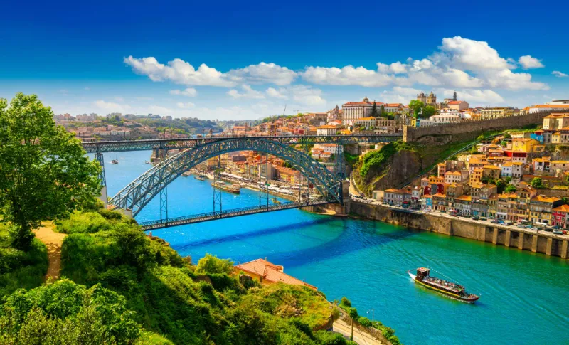The Dom Luís I bridge over the Douro river and the colourful Ribeira district in Porto