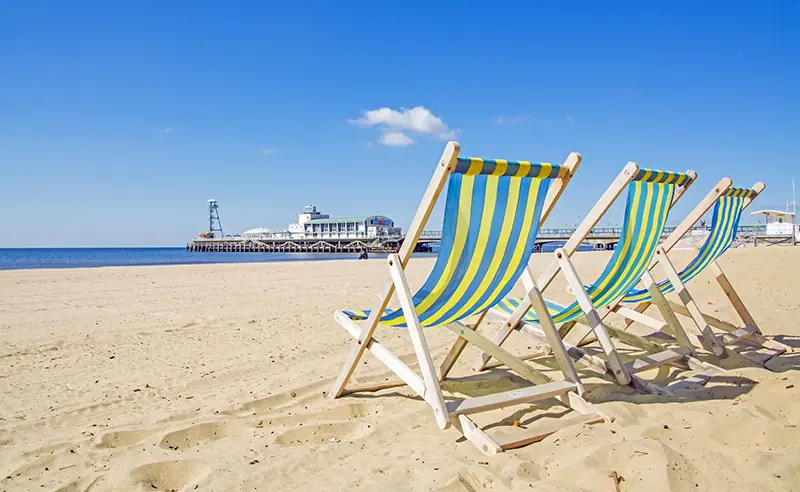 Deckchairs on Bournemouth Beach on a sunny day