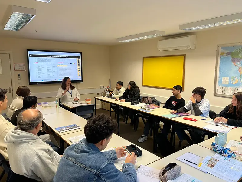 Students in class with interactive screen 2 at Southbourne School of English