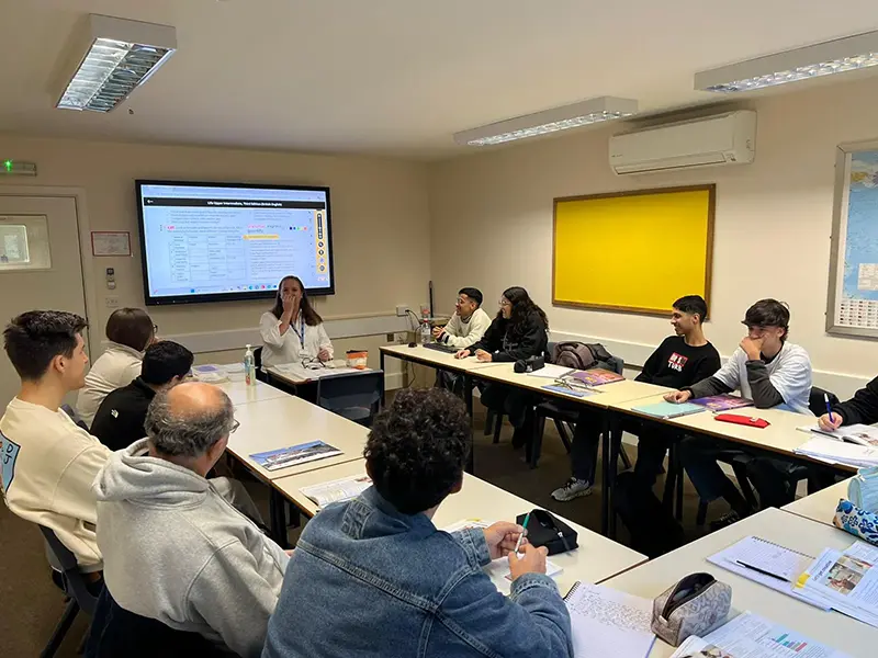 Students in class with an interactive screen