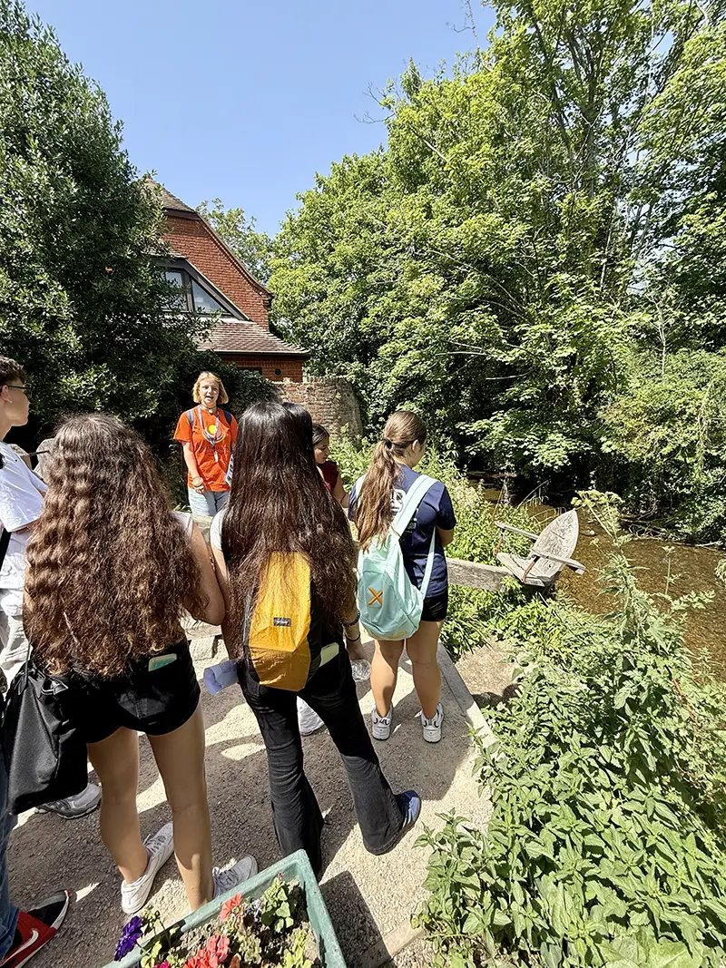 Students by river on local trip on a school excursion