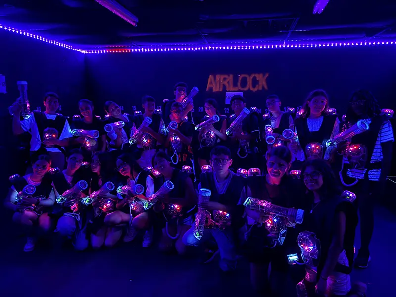 Students laser tag evening on a school excursion