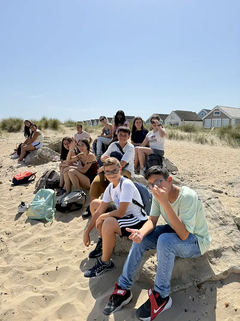 Students sat by Mudeford Quay