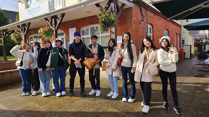 Students stood outside front entrance at Southbourne School