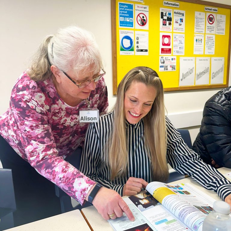 Adult student in class with teacher
